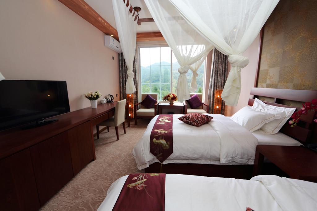 Panshan Tingquan Tuwo Holiday Resort Лешань Номер фото