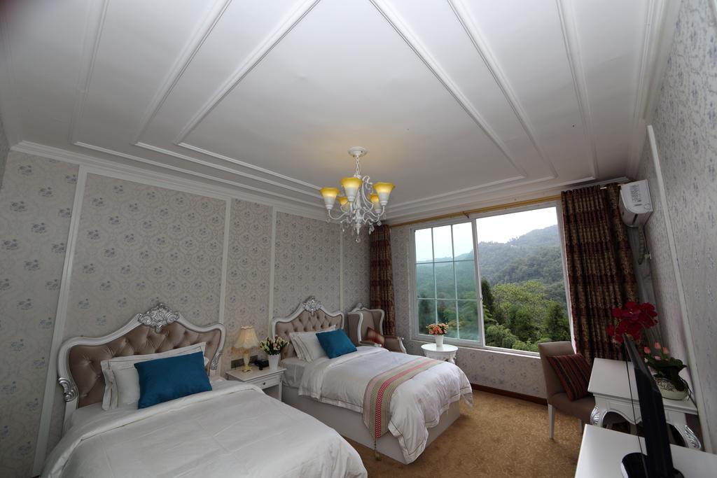 Panshan Tingquan Tuwo Holiday Resort Лешань Номер фото