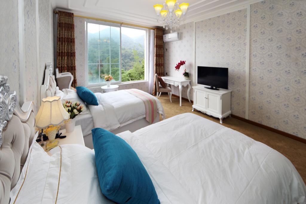 Panshan Tingquan Tuwo Holiday Resort Лешань Номер фото