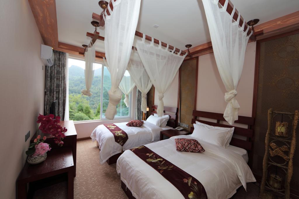 Panshan Tingquan Tuwo Holiday Resort Лешань Номер фото