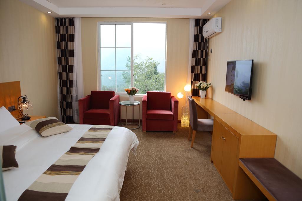 Panshan Tingquan Tuwo Holiday Resort Лешань Номер фото