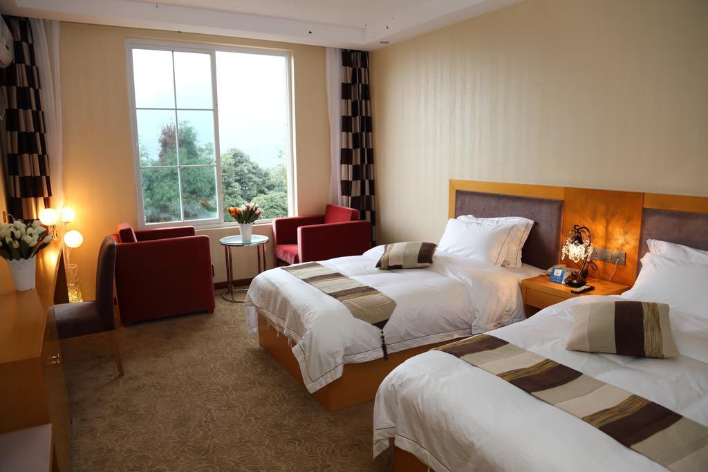 Panshan Tingquan Tuwo Holiday Resort Лешань Номер фото