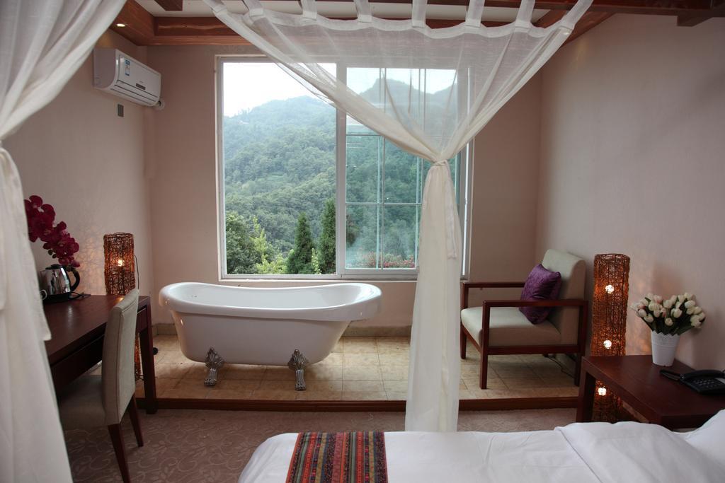 Panshan Tingquan Tuwo Holiday Resort Лешань Номер фото